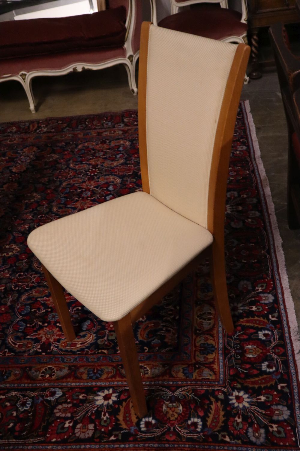 Skovby, Denmark, a patent cherrywood revolving expanding circular table with three integral leaves, width 145cm, height 73cm and a set